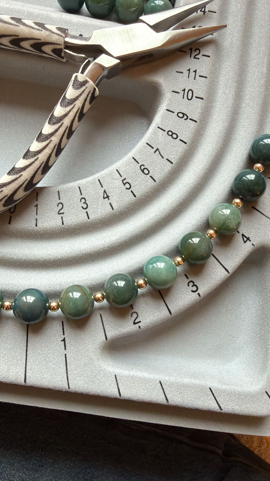 maison miso craftsmanship — hand-stringing a necklace